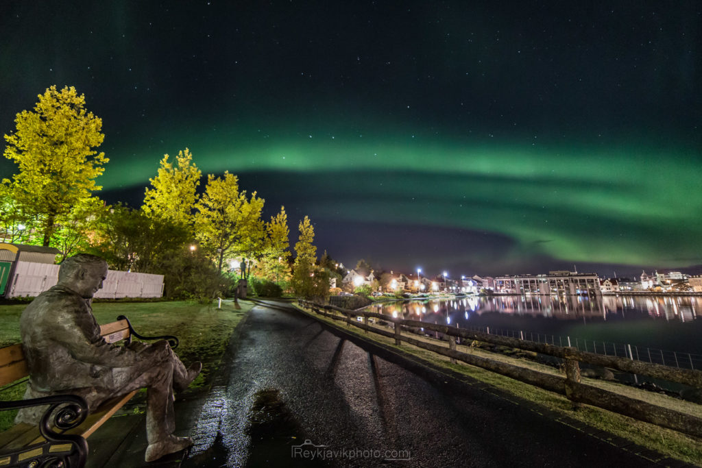 northern lights seen over the pond in Reykjavik